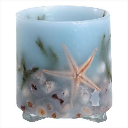 34042.jpg 34042: Sea Treasures Candle Lantern- Sea shells and starfish abound on this intriguing wax candle holder. Glass base. 100% paraffin wax shell. Tealights only ( not included). 3 7/8\" diameter x 4 3/8\" high. Retail Price:$12.95 image by strawn40