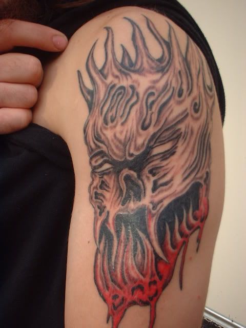bloody monster arm tattoo