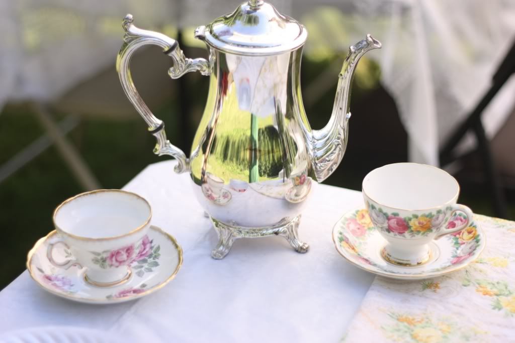 We used a tea pot and some dainty tea cups saucers as decor