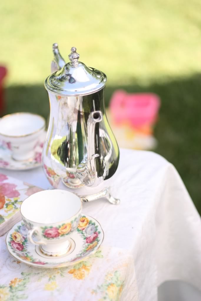 We used a tea pot and some dainty tea cups saucers as decor